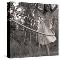 Young Girl Twirling Hula Hoop Outdoors In Sepia For Vintage Look-CherylCasey-Stretched Canvas