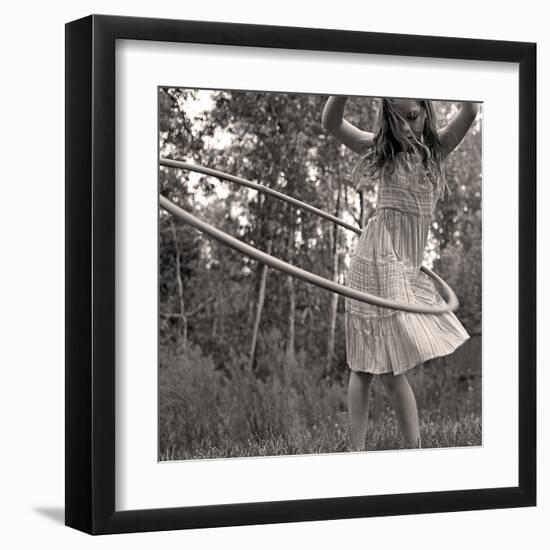 Young Girl Twirling Hula Hoop Outdoors In Sepia For Vintage Look-CherylCasey-Framed Art Print