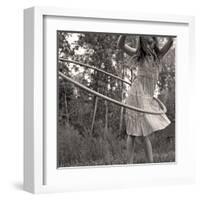 Young Girl Twirling Hula Hoop Outdoors In Sepia For Vintage Look-CherylCasey-Framed Art Print