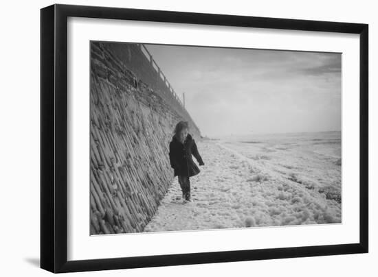 Young Girl Walking Beside the Sea Wall in England During Winter-Clive Nolan-Framed Photographic Print