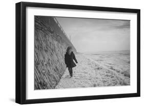 Young Girl Walking Beside the Sea Wall in England During Winter-Clive Nolan-Framed Photographic Print
