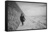 Young Girl Walking Beside the Sea Wall in England During Winter-Clive Nolan-Framed Stretched Canvas