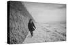 Young Girl Walking Beside the Sea Wall in England During Winter-Clive Nolan-Stretched Canvas