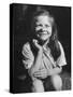 Young Girl with Long Hair and Raggedy Shirt, Smiling, Wearing Seed Pod on Nose-Ralph Morse-Stretched Canvas