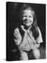Young Girl with Long Hair and Raggedy Shirt, Smiling, Wearing Seed Pod on Nose-Ralph Morse-Stretched Canvas