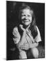 Young Girl with Long Hair and Raggedy Shirt, Smiling, Wearing Seed Pod on Nose-Ralph Morse-Mounted Photographic Print