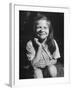 Young Girl with Long Hair and Raggedy Shirt, Smiling, Wearing Seed Pod on Nose-Ralph Morse-Framed Photographic Print