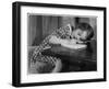 Young Girl Writes on Paper with a Pencil-null-Framed Art Print