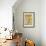 Young Girls Looks At a Selection of Old Needlepoints On a Wall-null-Framed Art Print displayed on a wall