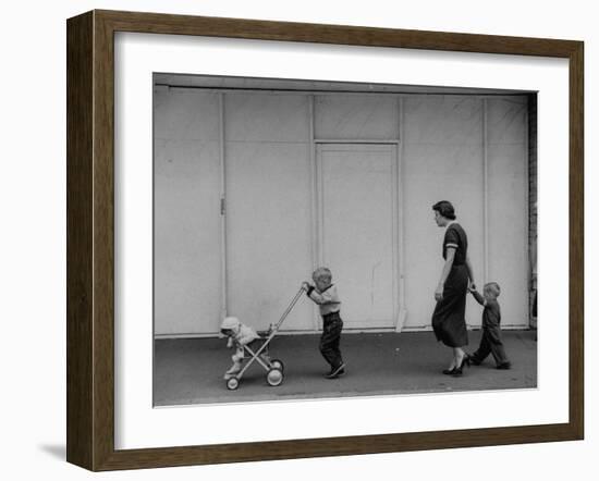 Young Housewife Walking with Her Three Children-Mark Kauffman-Framed Photographic Print