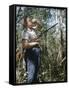 Young Hunter Blowing a Duck Decal Wistle while Holding His Rifle under His Arm-Al Fenn-Framed Stretched Canvas