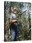 Young Hunter Blowing a Duck Decal Wistle while Holding His Rifle under His Arm-Al Fenn-Stretched Canvas