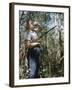 Young Hunter Blowing a Duck Decal Wistle while Holding His Rifle under His Arm-Al Fenn-Framed Photographic Print