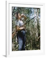 Young Hunter Blowing a Duck Decal Wistle while Holding His Rifle under His Arm-Al Fenn-Framed Photographic Print