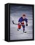 Young Ice Hockey Player in Action-null-Framed Stretched Canvas