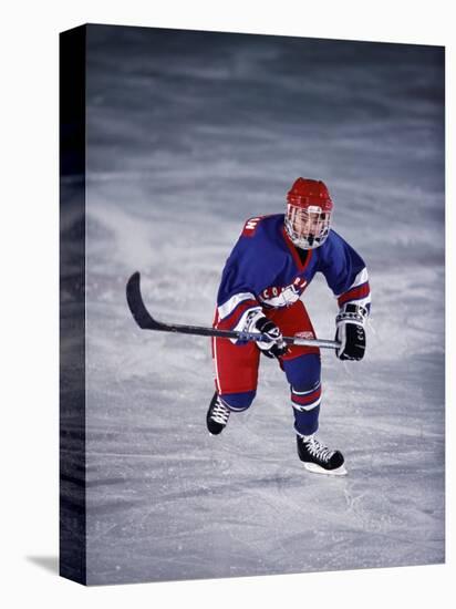 Young Ice Hockey Player in Action-null-Stretched Canvas