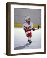 Young Ice Hockey Player in Action-null-Framed Photographic Print