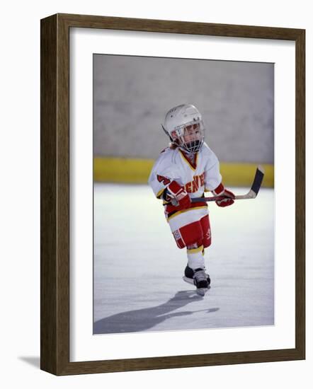 Young Ice Hockey Player in Action-null-Framed Photographic Print