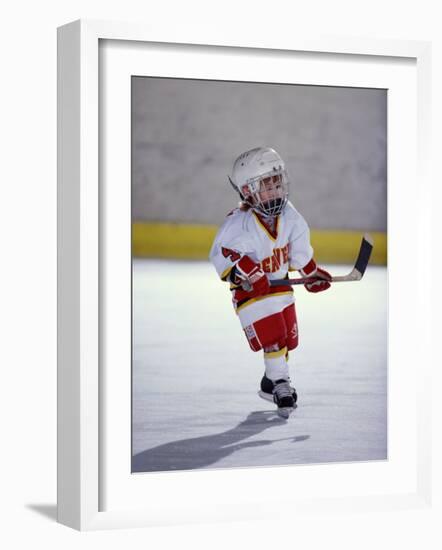 Young Ice Hockey Player in Action-null-Framed Photographic Print