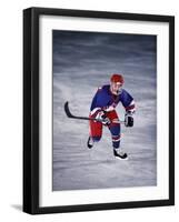 Young Ice Hockey Player in Action-null-Framed Photographic Print