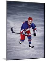 Young Ice Hockey Player in Action-null-Mounted Photographic Print