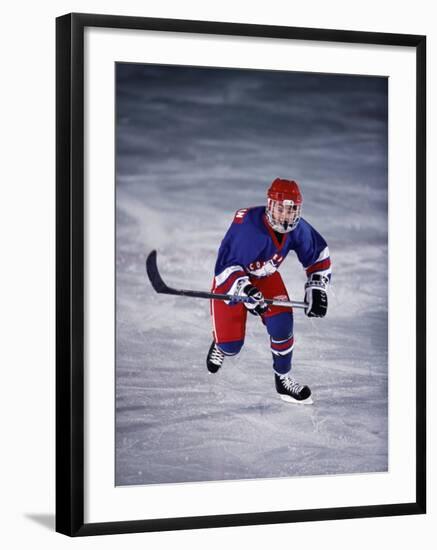 Young Ice Hockey Player in Action-null-Framed Photographic Print