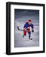 Young Ice Hockey Player in Action-null-Framed Photographic Print