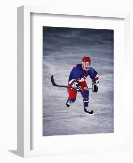 Young Ice Hockey Player in Action-null-Framed Photographic Print