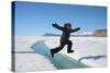 Young Inuit Boy Jumping over a Crack on Ice Floe, Ellesmere Island, Nanavut, Canada, June 2012-Eric Baccega-Stretched Canvas