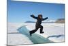 Young Inuit Boy Jumping over a Crack on Ice Floe, Ellesmere Island, Nanavut, Canada, June 2012-Eric Baccega-Mounted Photographic Print