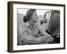 Young Israeli Woman Singing While Accompanied by Someone Playing an Accordion-Paul Schutzer-Framed Photographic Print