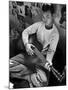 Young Japanese Nisei Playing Guitar in the Stockade at Tule Lake Segregation Center-Carl Mydans-Mounted Photographic Print