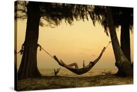 Young Lady Reading the Book in the Hammock on Tropical Beach at Sunset-Dudarev Mikhail-Stretched Canvas