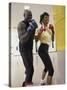 Young Male Coach Coaching a Female Boxer-null-Stretched Canvas