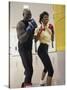 Young Male Coach Coaching a Female Boxer-null-Stretched Canvas