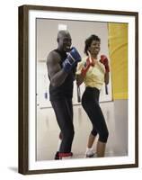 Young Male Coach Coaching a Female Boxer-null-Framed Premium Photographic Print