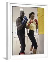 Young Male Coach Coaching a Female Boxer-null-Framed Premium Photographic Print