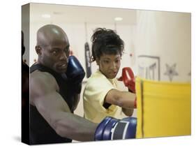 Young Male Coach Coaching a Female Boxer-null-Stretched Canvas