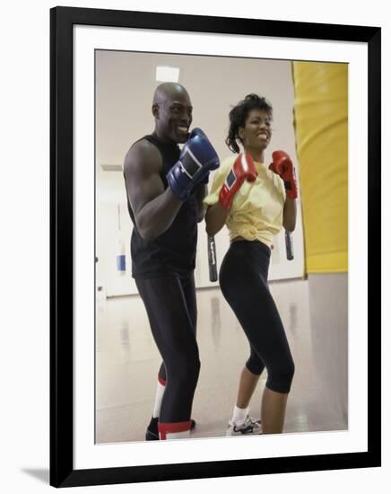 Young Male Coach Coaching a Female Boxer-null-Framed Photographic Print