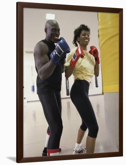 Young Male Coach Coaching a Female Boxer-null-Framed Photographic Print