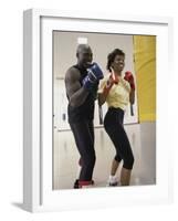 Young Male Coach Coaching a Female Boxer-null-Framed Photographic Print