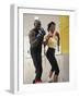 Young Male Coach Coaching a Female Boxer-null-Framed Photographic Print