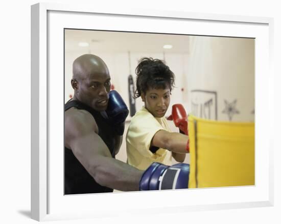 Young Male Coach Coaching a Female Boxer-null-Framed Photographic Print