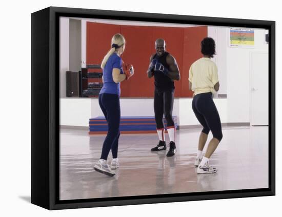 Young Male Coach Coaching Two Female Boxers-null-Framed Stretched Canvas