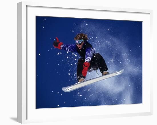 Young Male Snowboarder in Action-null-Framed Photographic Print