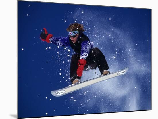 Young Male Snowboarder in Action-null-Mounted Photographic Print