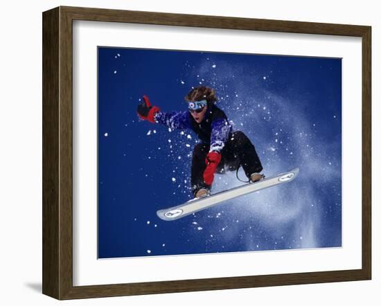 Young Male Snowboarder in Action-null-Framed Photographic Print