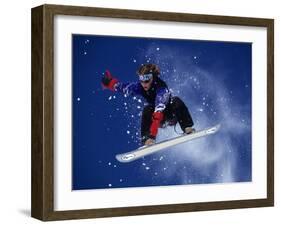 Young Male Snowboarder in Action-null-Framed Photographic Print