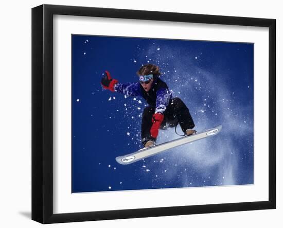 Young Male Snowboarder in Action-null-Framed Photographic Print
