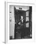 Young Man Blocking the Entrance to the "Lift", in America it Is Called an Elevator-null-Framed Photographic Print